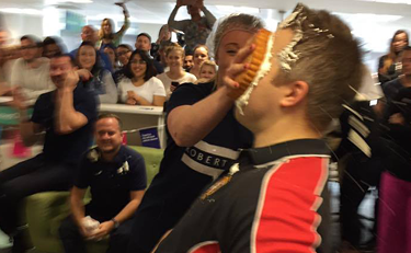 A manager takes a pie to the face to help raise money for Cancer Research UK