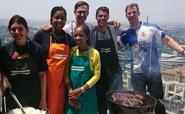 The team in Johannesburg hosts a charity barbecue to raise funds for charity Door of Hope