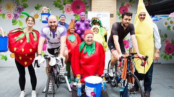 Staff dressed as fruit or riding bicycles, raising money for Charity Day 2018