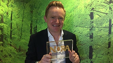 Steve Coxall, Robert Walters EMEA and Americas Marketing Director,  holds up NORA award