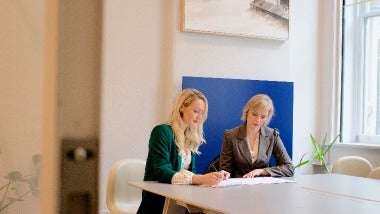 Two ladies working in an office